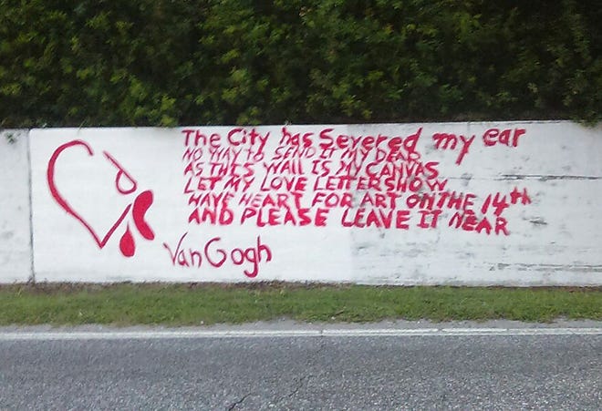 A sign painted on a wall just feet from the van Gogh mural chides city officials for their opposition to the mural. The sign was painted over by midday Monday. [SUBMITTED]