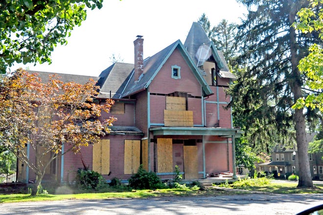 Despite efforts to preserve it by The College of Wooster and a private group, the historic Overholt House on Beall Avenue — boarded up with some of its exterior and interior features stored — will soon be demolished.