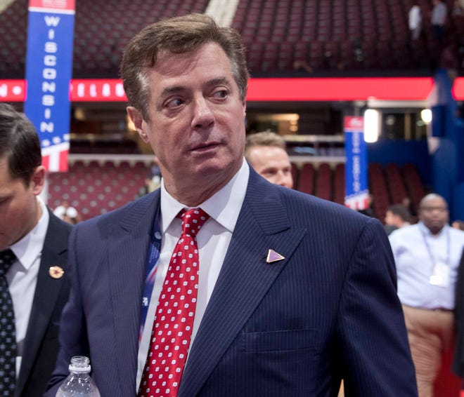 In this July 18, 2016 file photo, then-Trump campaign chairman Paul Manafort walks around the convention floor before the opening session of the Republican National Convention in Cleveland. A spokesman for President Donald Trump’s former campaign chairman, Paul Manafort, says that FBI agents served a search warrant at one of his homes. (AP Photo/Carolyn Kaster, File)