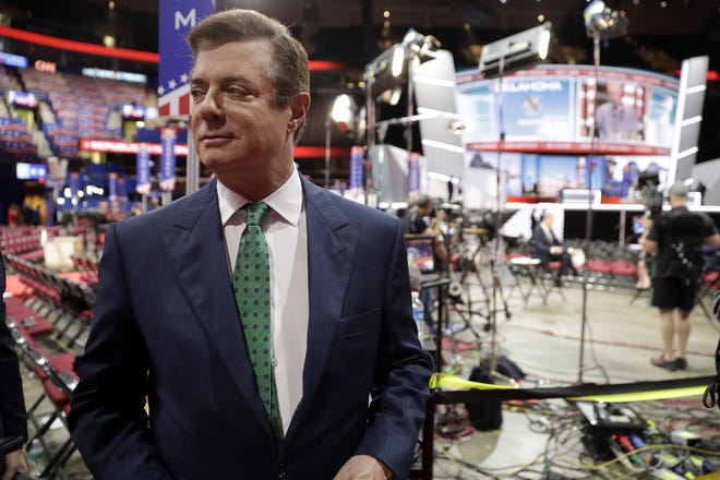 In this photo taken July 17, 2016, Paul Manafort talks to reporters on the floor of the Republican National Convention at Quicken Loans Arena in Cleveland. FBI agents raided the Alexandria home of President Trump’s former campaign chairman late last month, using a search warrant to seize documents and other materials, according to people familiar with the special counsel investigation into Russian meddling in the 2016 election. (AP Photo/Matt Rourke)