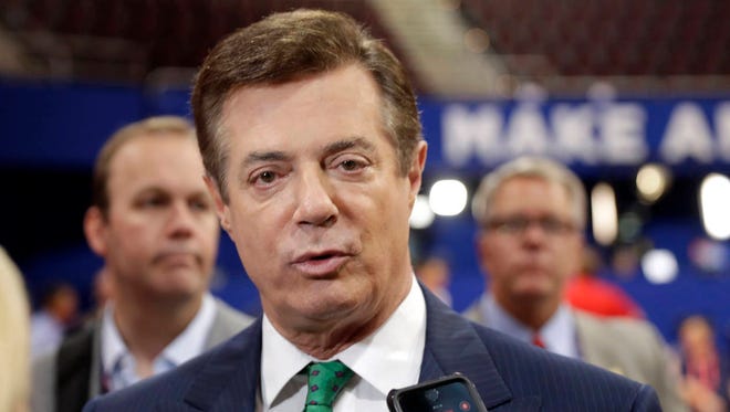 In this July 17, 2016 file photo, then-Trump Campaign Chairman Paul Manafort talks to reporters on the floor of the Republican National Convention in Cleveland. (Associated Press)