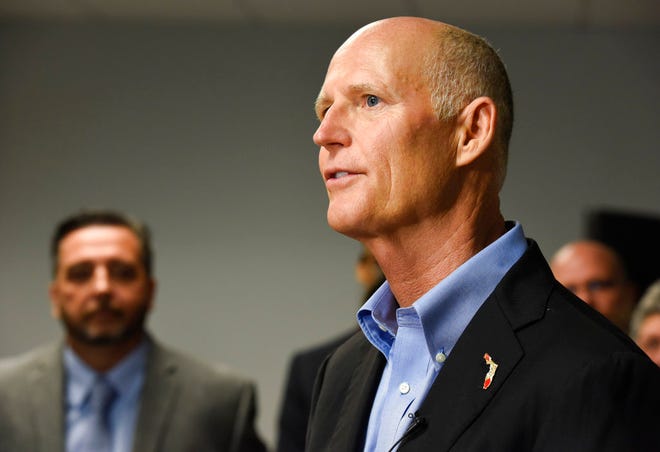 Florida Gov. Rick Scott speaks to reporters during a news conference at ThinkAnew Tuesday in Tampa. ThinkAnew, which recently opened offices in Tampa, specializes in offering information technology services mainly for small to midsize healthcare companies.