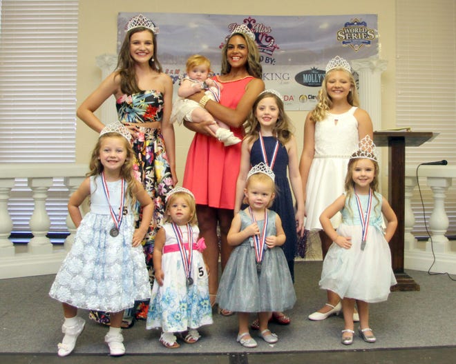 Winners from this year's Little Miss American Legion pageant are, from front right, Tiny Miss Charlie Hamrick, Toddler Miss Lillee Falls, Mini Miss Emmalyn Beam, Mini Grand Majestic Izabella Norman; back row, Young Miss Kaitlyn Wesson, Baby Miss Mary Elizabeth Rumfelt, Grand Majestic Makayla Lafone, Little Miss Meadow Parsons and Junior Miss Zoe Hodge. [Photo courtesy of Victorian Rose Studio]