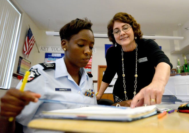 Leesburg High School math teacher Tammy Jerkins, who is the reigning Florida Teacher of the Year, assists student Doreen Barrett at Leesburg High School on Feb. 8 in Leesburg. [DAILY COMMERCIAL FILE]
