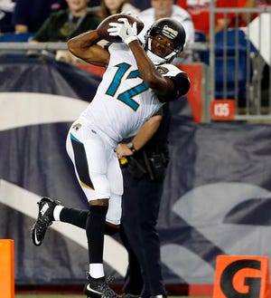 Jaguars wide receiver Dede Westbrook catches a pass at the goal line for a touchdown during the second of the preseason opener at New England. (AP Photo/Mary Schwalm)