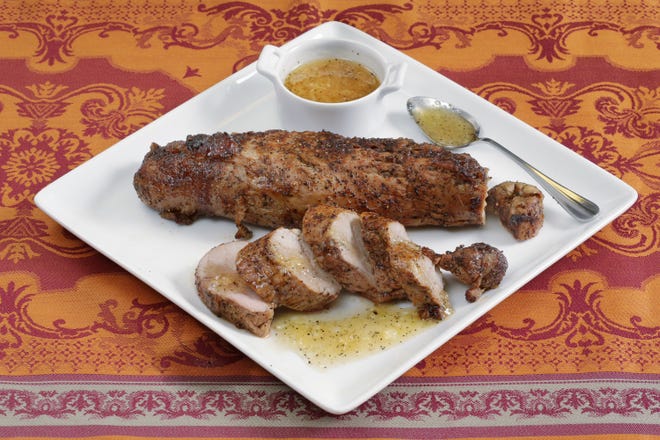 Crusty pork tenderloin, made with a barbecue rub of dark brown sugar, salt, pepper and paprika. This dish is from a recipe by Elizabeth Karmel. (AP Photo/Richard Drew)