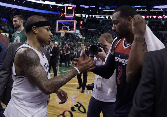 The Celtics' Isaiah Thomas, left and the Wizards' John Wall, shaking hands after Game 7 of last year's Eastern Conference semifinals, will square off on Christmas Day in Boston.