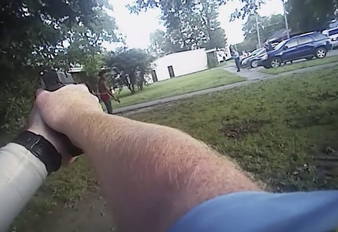 An image from a July 25, 2017, police body camera video released by the District Prosecuting Attorney's Office shows Aries Clark, 16, holding a black BB gun that looked like a handgun before he was shot in Marion. Two eastern Arkansas police officers won't face charges in the fatal shooting of a black teenager outside an emergency youth shelter, a prosecutor said Wednesday, Aug. 9, 2017. (District Prosecuting Attorney's Office via AP)