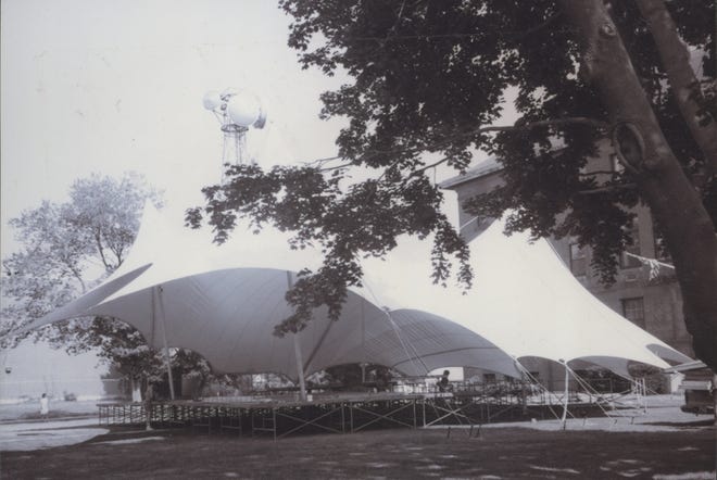 The tent is up on the Hyannis Village Green – in August 1987 – in anticipation of the second annual Pops by the Sea concert featuring the Boston Pops Esplanade Orchestra under the direction of Conductor Harry Ellis Dickson. [BARNSTABLE PATRIOT FILES/W.B. NICKERSON CAPE COD HISTORY ARCHIVES]