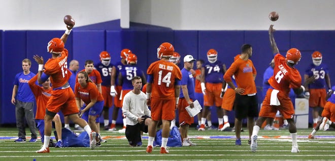 Florida quarterbacks Feleipe Franks (13), Luke Del Rio (14) and Malik Zaire (8) get in some work at a recent practice at the Indoor Practice Facility on campus in Gainesville. [Brad McClenny / Gatehouse Media]