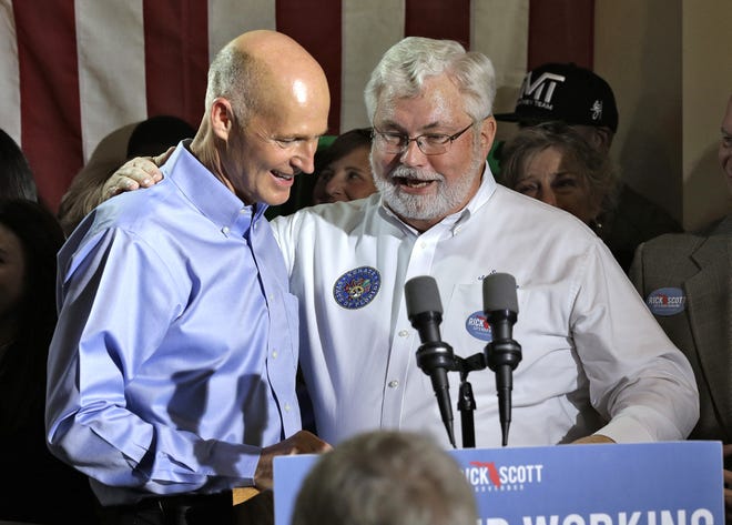 Florida Gov. Rick Scott, left, hugs Florida Sen. Jack Latvala, R-District 20, during a campaign speech on Nov. 3, 2014, in Clearwater. [Chris O'Meara / AP]