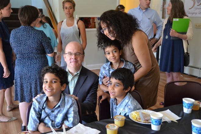Congressman Jim McGovern stands with Chrifa Khaddaoui and her sons Fkihi Mohamed, 9, Fhiki Naim, 7, and Fhiki Omar, 6. DAVID DORE PHOTO
