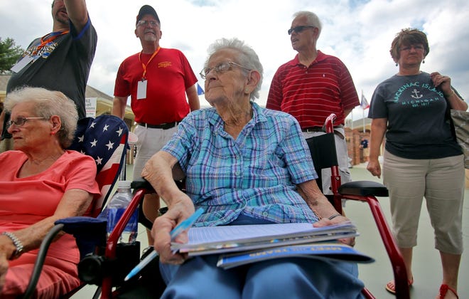 Jo Westberg, 89, takes stats during Game Two of the American Legion World Series on Thursday. [Brittany Randolph/The Star]