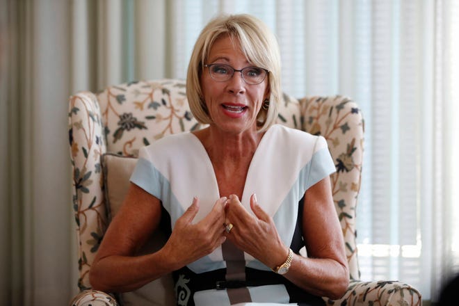 In this Aug. 9, 2017, photo, Education Secretary Betsy DeVos is interviewed by The Associated Press in her office at the Education Department in Washington. It’s been six months since her bruising Senate confirmation battle, and DeVos remains highly divisive.(AP Photo/Jacquelyn Martin)