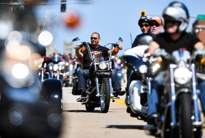 RON JOHNSON/JOURNAL STAR Hundreds of motorcycles travel down Hamilton Boulevard to the Peoria riverfront and the Grand Nationals Weekend event on Saturday.