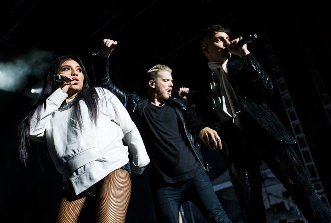 Singers Kirstin Maldonado, Scott Hoying and Mitch Grassi, of Pentatonix perform "Cracked" on the Grandstand stage at the Illinois State Fairgrounds, Saturday, Aug. 12, 2017, in Springfield, Ill. [Justin L. Fowler/The State Journal-Register]