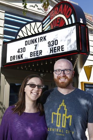 Pastors Allyssa and Joe Graves pose for a portrait in front of the Grandview Theater and Drafthouse, recently, where they are starting a church, Central City Church. (GateHouse Ohio Media Fred Squillante/Dispatch)