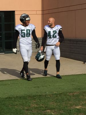 Linebacker Jordan Hicks (left) and safety Chris Maragos take the field Sunday, Aug. 13, 2017, only to see one of their new teammates already wearing the same number their close friend, Jordan Matthews, wore.