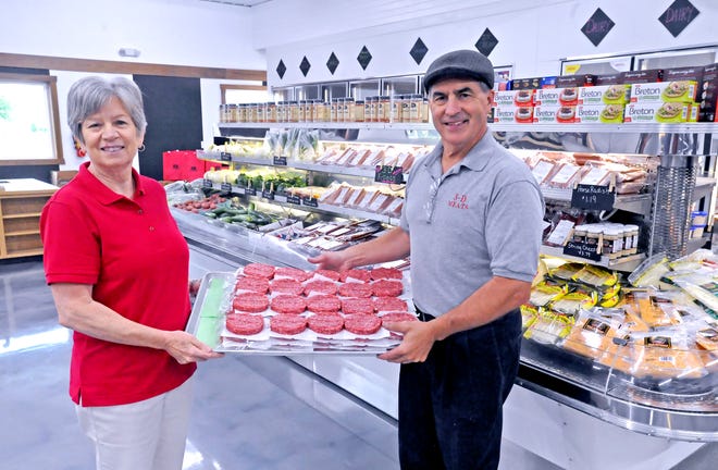 3-D Meats owners and operators Jan and Leon Hilty show off the hamburger patties offered at their new meat counter and retail store along East Lincoln Way in Dalton.