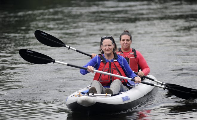 Carolyn Choate, left, and her daughter Sydney Choate Turnbull paddle into shore at the Bushkill Access along the Delaware in the Delaware Water Gap National Recreation Area on Friday, August 11, 2017. The two are on a paddling adventure where they will be kayaking more than 300 miles as part of a new, River of Life fundraising initiative that will pay tribute to Dr. Angela Brodie, who discovered a class of drugs to treat estrogen-positive breast cancer. The kayak trek will end at the Inner Harbor in Baltimore. [Keith R. Stevenson/Pocono Record]