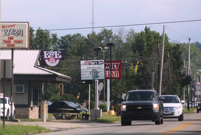 TIMES-REPORTER PAT BURK

Some of the 20 or so restaurants, including (left to right) Kraus Pizza, E&E Ice Cream Shop, McDonald's and Taco Bell, along U.S. Route 250 (Wooster Avenue) in Strasburg.