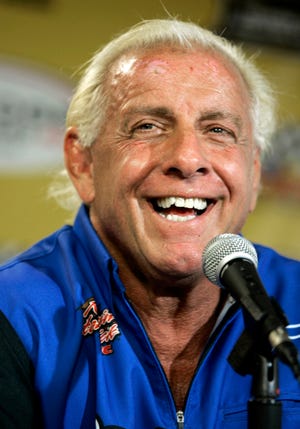 In this Sept. 22, 2007, file photo, wrestler Ric Flair addresses the media during a news conference at Dover International Speedway in Dover, Del. Flair’s representative said on Twitter Aug. 14, 2017, that Flair was dealing with some “tough medical issues.” (AP Photo/Carolyn Kaster, File)
