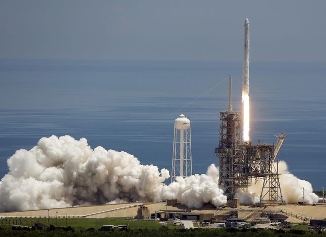 A Falcon 9 SpaceX rocket launches from pad 39A at the Kennedy Space Center in Cape Canaveral on Monday. The mission of the spacecraft is a cargo and supply delivery to the International Space Station. [John Raoux / AP]