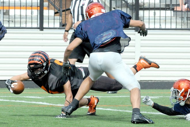 Preston Hodges of Massillon dives with the ball during a scrimmage against the Berea-Midpark Titans on Saturday. (CantonRep.com / Michael Balash)