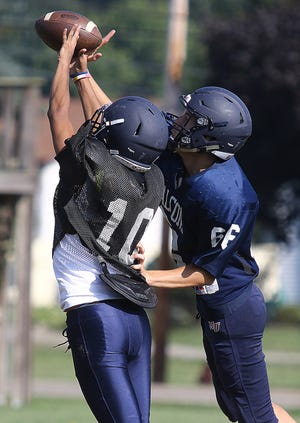 Fairless' Caleb Kelly tries to break up a pass intended for temmate Bronson Lee (10) at practice.

 (IndeOnline.com / Kevin Whitlock)