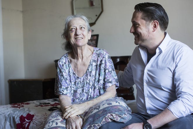 Carol King, who has Alzheimer's disease, with her son, Geoffrey King, in her room at a San Francisco residence for older adults. Carol King was detained by police after an incident in the residence last summer. [LAURA MORTON / THE NEW YORK TIMES]