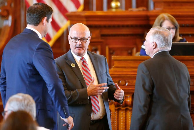 In this file photo, House Minority Leader Jim Ward, D-Wichita, center, speaks with House Majority Leader Don Hineman, R-Dighton, right, and House Speaker Ron Ryckman, R-Olathe. (May 2017 file photo/The Capital-Journal)