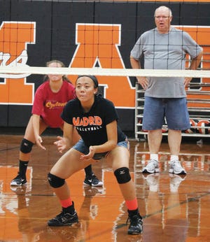 Madrid volleyball coach Garry DeWall looks on during a recent practice as Kyra Troendle awaits a serve. Troendle is one of the returners Madrid will be counting on this season. Photo by Andrew Logue/News-Republican