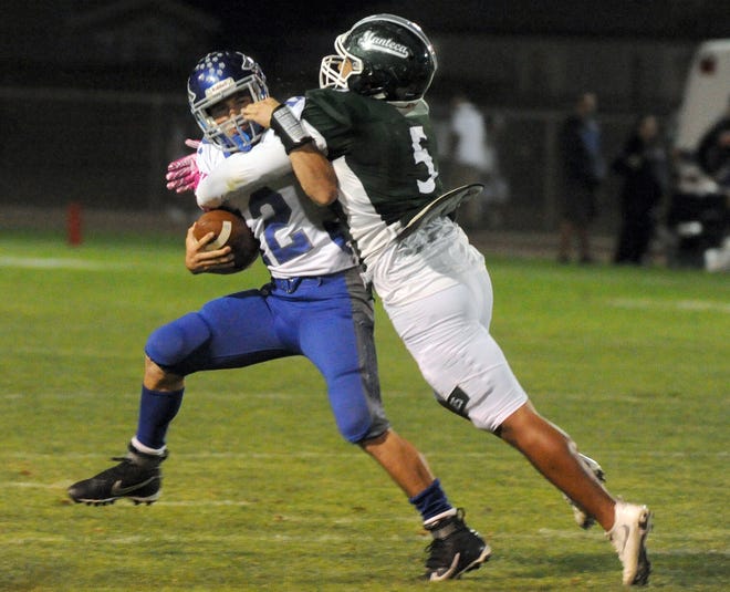 Manteca linebacker Ferrin Manuleleua, right, tackles Sierra quarterback Mark Vicente during their Valley Oak League football game on Oct. 8, 2016, at Guss Schmiedt Field in Manteca. Manuleleua is No. 9 on The Record's Top 50 Football Returner Rankings. [CALIXTRO ROMIAS/RECORD FILE 2016]