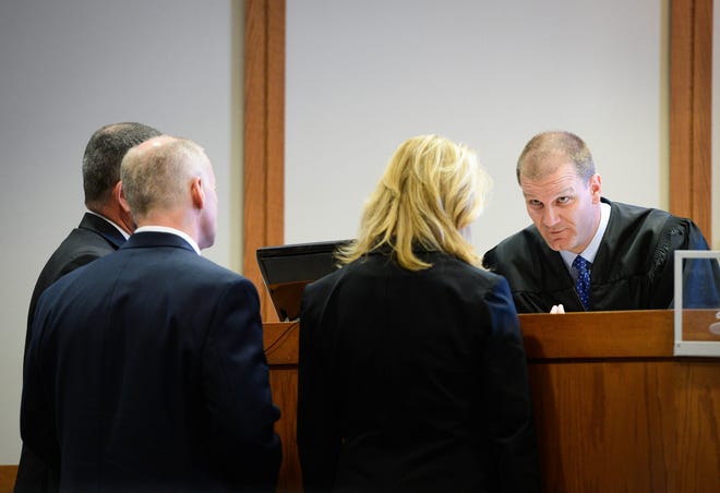 Judge Thomas Krug, right, speaks with the attorney for Frank Bybee and prosecutors for the state in February. [HERALD-TRIBUNE ARCHIVE]