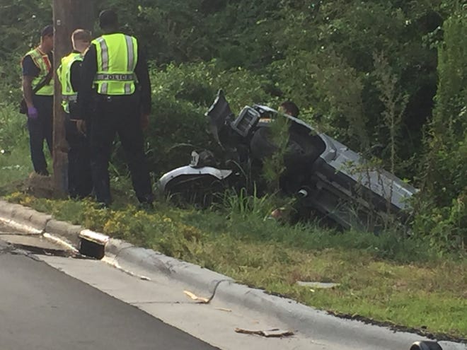 A Fayetteville woman's car was cut open in order to rescue her after a single-vehicle wreck on Bragg Boulevard on Thursday afternoon. [Nancy McCleary/The Fayetteville Observer]
