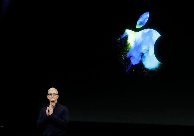 In this Oct. 27, 2016, file photo, Apple CEO Tim Cook speaks during an announcement of new products in Cupertino, Calif. Apple is donating $2 million to two human rights groups as part of Cook’s pledge to help lead the fight against the hate that fueled the violence in Charlottesville, Va., during a white-nationalist rally. Cook made the commitment late Wednesday, Aug. 16, 2017, in an internal memo obtained by The Associated Press. (AP Photo/Marcio Jose Sanchez, File)