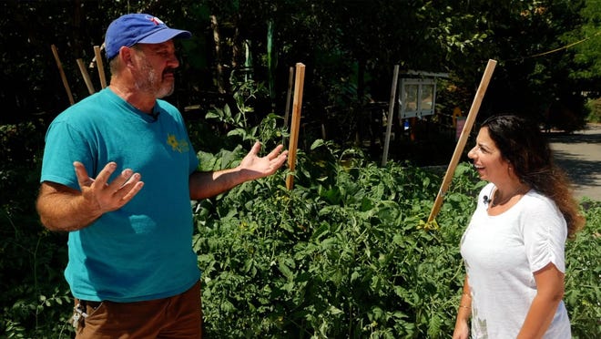 Jeff Clarke, Camden Children’s Garden Garden Supervisor, speaks with Tina Sottolano-Cain.
