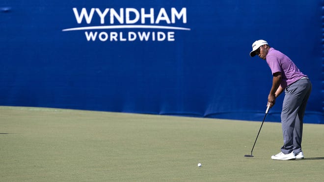 Harold Varner III makes a putt attempt on the 15th hole during the first round of the Wyndham Championship golf tournament, Thursday, Aug. 17, 2017, in Greensboro, N.C. (Andrew Krech/News & Record via AP)
