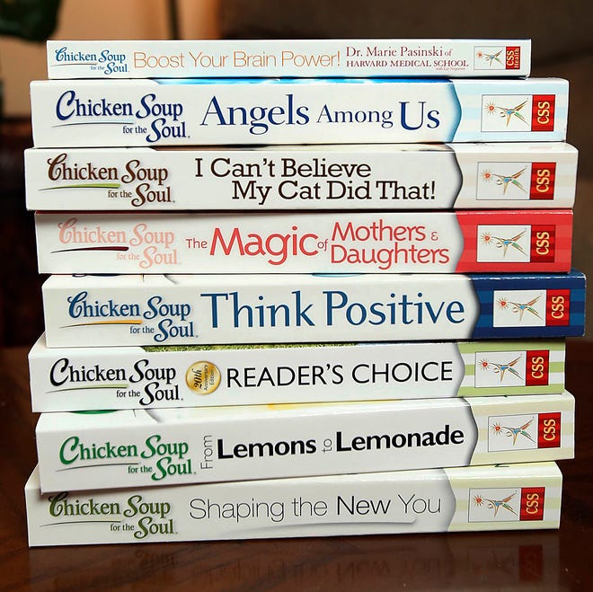 FILE - This July 5, 2013, file photo, shows some of the titles in the Chicken Soup for the Soul series on display at the home of Debbie Acklin, in Northport, Ala. Acklin has had stories published in the series. Chicken Soup for the Soul Entertainment Inc. is becoming a publicly traded company Friday, Aug. 18, 2017. (Dusty Compton/The Tuscaloosa News via AP, File)