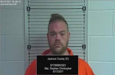 Stephen Christopher Mai was booked Thursday into the Jackson County Jail after being arrested with guns and illegal drugs, including a large amount of a substance thought to be methamphetamine, authorities said. (Jackson County Jail)