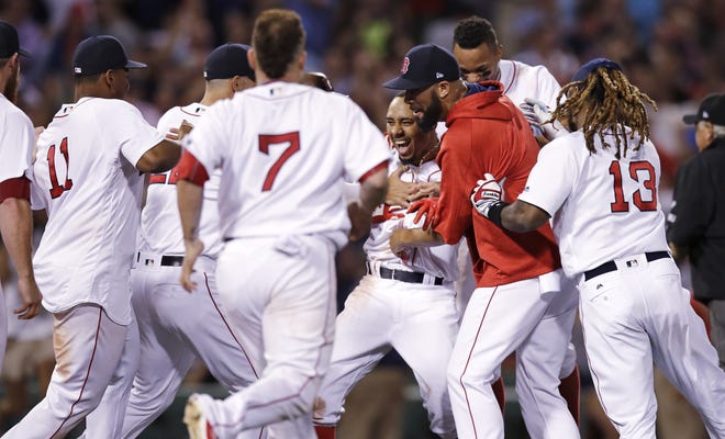 Red Sox outfielder Mookie Betts, shown getting mobbed on Wednesday, gave Boston its ninth walk-off win this season.