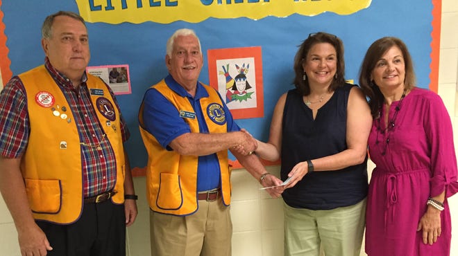 The Oconee Lions Club recently presented a check to staff at Oconee Primary School for the purchase of sensory equipment for special-needs students. Shown are, from left, Lion member Doug Mattocks, Lion President Wayne Fair, speech pathologist Wendy Harrison and school Director of Special Education Susanne Korngold.