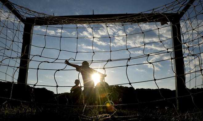RON JOHNSON/JOURNAL STAR The sun sets on a hot Thursday afternoon as temperatures reached into the 90's while pee wee soccer players got their kicks at Detweiller Park. 



Hot weather , heat