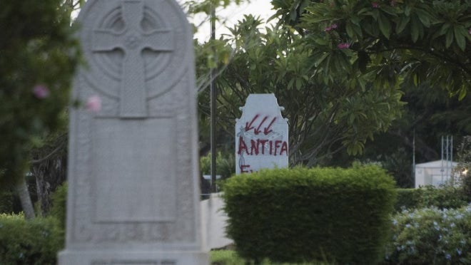 Pictured is a defaced confederate monument, seen at Woodlawn Cemetery in West Palm Beach, Fla., on Sunday, August 20, 2017. (Andres Leiva / The Palm Beach Post)