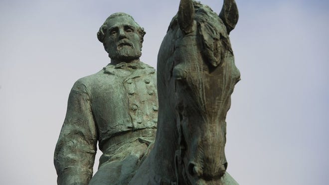 The statue of Confederate Army of Northern Virginia Gen. Robert E. Lee stands in Emancipation Park in Charlottesville, Va., Friday, Aug. 18, 2017. Charlottesville Mayor Mike Signer is expected to make an announcement regarding the Robert E. Lee statue later in the day. (AP Photo/Cliff Owen)