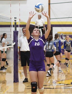 Kiana Mayer of Bronson sets a ball up for a teammate on Saturday morning.