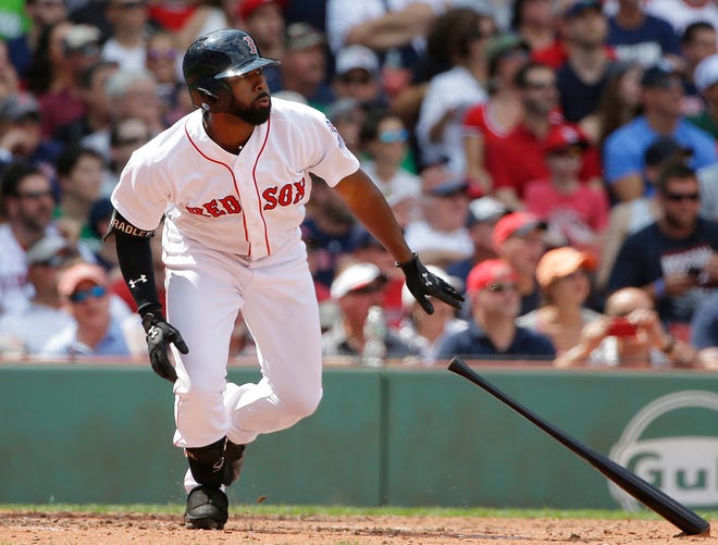 Boston Red Sox's Jackie Bradley Jr. watches the flight of his two-run triple off a pitch by New York Yankees' Sonny Gray in the second inning of a baseball game, Sunday, Aug. 20, 2017, in Boston. (AP Photo/Steven Senne)