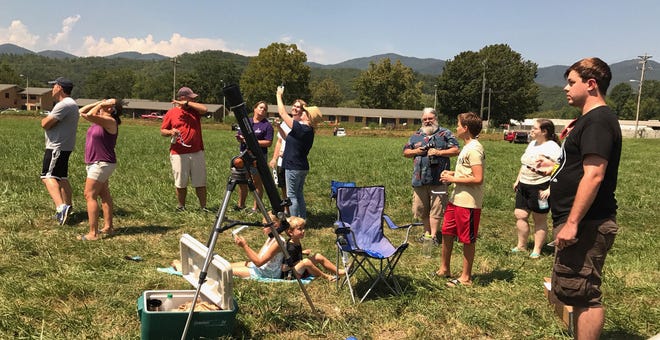 A group of people, including several Pittsburgh natives, gather Monday afternoon in the Blue Ridge Mountains in northern Georgia to watch the solar eclipse. The site was in the "Path of Totality" for the eclipse. Staff writer Kirstin Kennedy was there.
