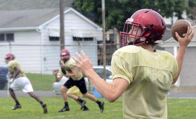 New Brighton quarterback Jackson Hall makes a pass during the first day of heat acclimation week at Oak Hill Field.