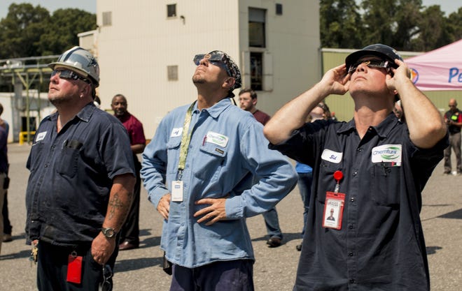 Lanxess, formerly known as Chemtura Corp., treated its employees to flavored snowballs during an eclipse viewing party Monday, Aug. 21. [DEMETRIA MOSLEY/THE GASTON GAZETTE]